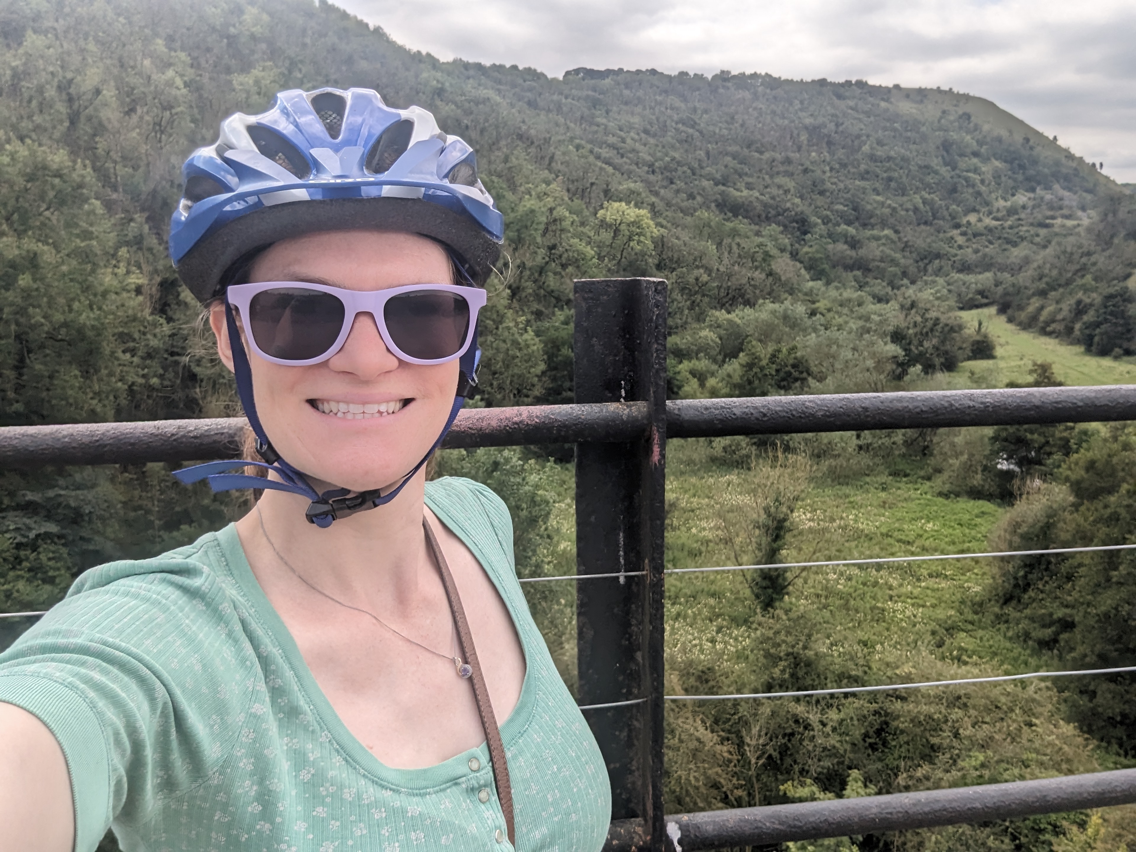 Nicola wearing her helmet mid cycle ride