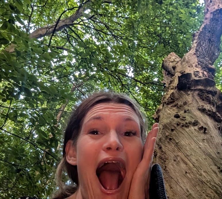 Nicola Smith doing a dramatic scream face next to the Y tree